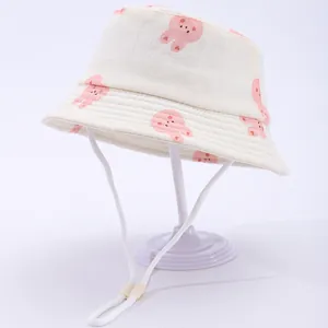 Detail of baby bucket hat with cartoon rabbit pattern and adjustable windproof chin strap