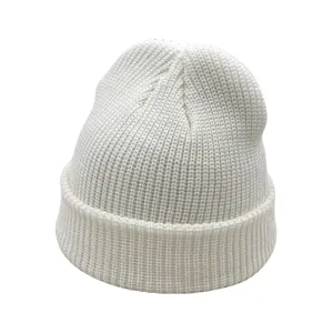 Detail shot of the white ribbed knit beanie featuring thick folded brim texture