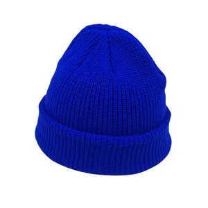 Detailed macro view of the royal blue ribbed knit texture and folded cuff on this beanie