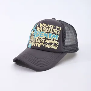 Macro detail of charcoal grey trucker hat with breathable mesh and vintage typography