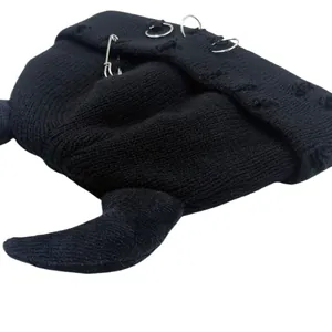 Black knit devil horn beanie with punk silver rings, pins and distressed hole details