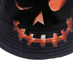 Halloween bucket hat with orange Jack-o'-lantern pumpkin print on black canvas fabric