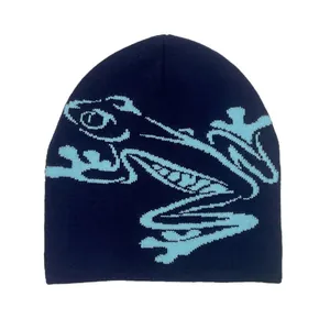 Detailed knit texture of the navy blue beanie with light blue frog graphic design