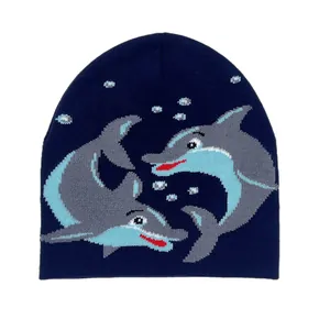 Detailed knit texture of navy blue beanie featuring gray dolphin jacquard patterns