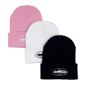 Three-pack stylish knit beanies in pink, white, and black with landscape logo embroidery