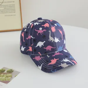 Detailed view of kids navy baseball cap with colorful dinosaur prints and cotton texture