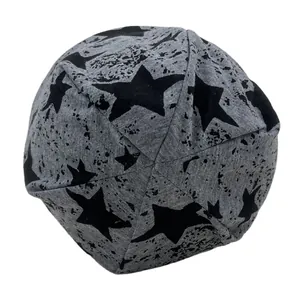 Grey knit beanie featuring black stars and ink splatter print with a six-seam top design