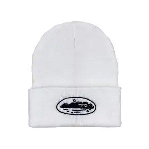 Detail of white knit beanie with ribbed texture and black island embroidery on cuff