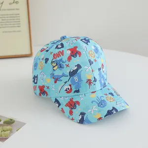 Detailed macro view of sea-themed print on light blue cotton baseball cap for kids