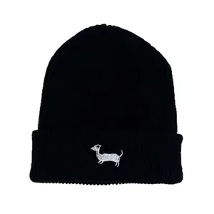 Classic black knitted beanie featuring white dog embroidery in minimalist ribbed style