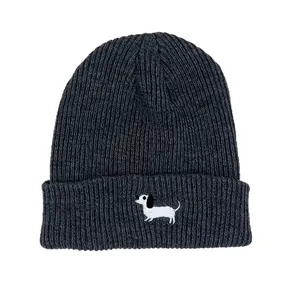 Close-up of charcoal gray knit beanie featuring a white dachshund dog embroidery detail