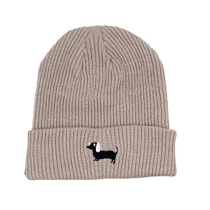 Oatmeal ribbed knit beanie featuring detailed black dachshund embroidery on the cuff