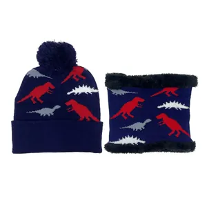 Kids navy blue knitted hat and neck warmer set with dinosaur pattern and pom-pom