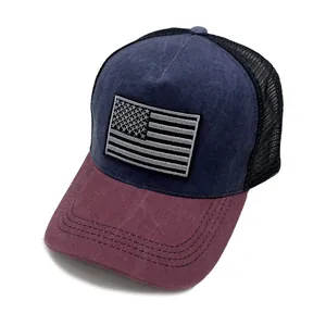 Detail of vintage American flag embroidery on dark blue washed cotton trucker cap