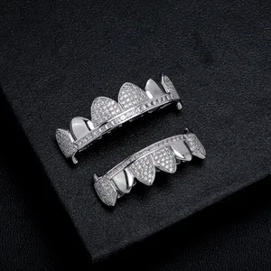 Hip hop silver plated iced out teeth grillz set with shiny CZ stones on black background