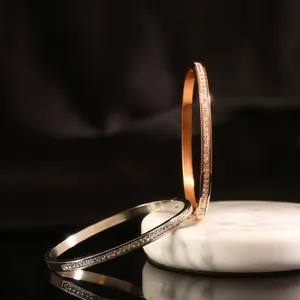 Minimalist single-row crystal bangle in rose gold and silver finishes for women