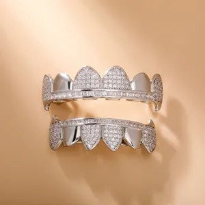 Macro view of silver plated hip hop grillz set with sparkling diamond micro-pave texture