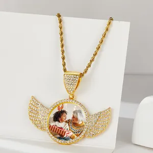 Custom gold angel wing photo locket pendant with sparkling zircons and twisted chain