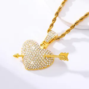 Close-up of hip-hop broken heart pendant with arrow and sparkling crystals