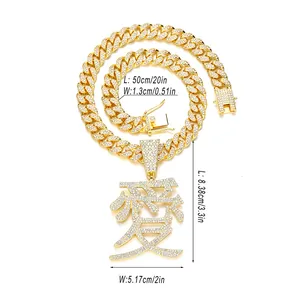 Close-up of hip hop cuban chain necklace with diamond-encrusted Kanji Love pendant