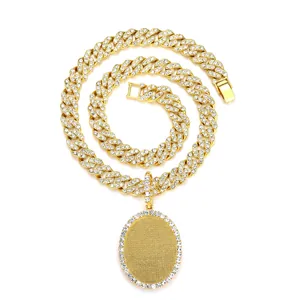 Close-up of hip hop gold Cuban chain with rhinestone encrusted oval photo locket