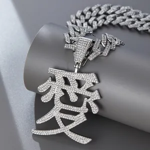 Macro detail of silver hip hop necklace featuring iced-out Chinese Love character pendant