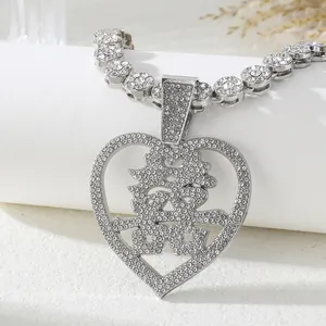 Macro view of silver heart pendant with Chinese Xi character and sparkling tennis chain