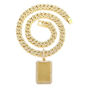 Macro shot of gold iced out Cuban link chain with rectangle pendant and pavé rhinestones