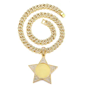 Close-up of golden hip hop star pendant with iced out rhinestones on Cuban link chain