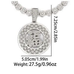 Macro view of crystal encrusted Fu character pendant with coin pattern measuring 7.25cm