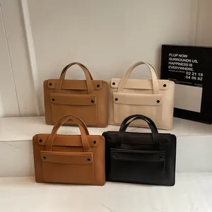 Minimalist leather laptop briefcases for women in brown, beige, and black colors