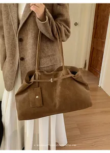 Brown retro tote bag with minimalist design and small hanging pouch for autumn fashion
