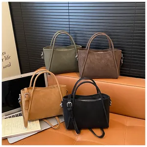 Minimalist vintage bucket bags in four colors with suede texture and silver hardware details