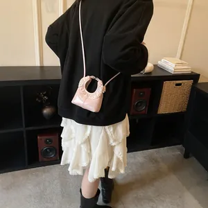 Pink lace trim shoulder bag with round handle and detachable crossbody strap for women