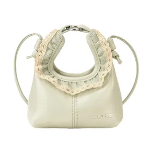 Mint green shoulder bag with lace lace trim and plaid stitching for a vintage style