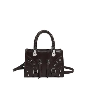 Dark brown leather motorcycle handbag with silver rivets and woven top handles