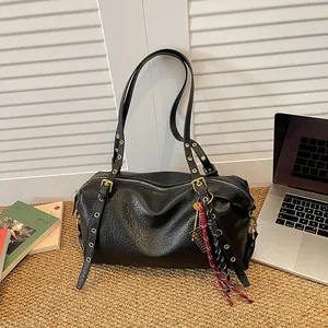 Retro black Boston shoulder bag with punk metal eyelets and textured faux leather