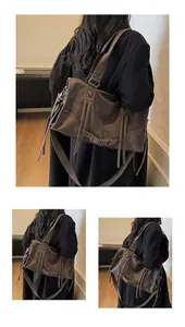 Detailansicht der großen braunen Retro-Schultertasche mit Fransen und Schnür-Akzenten
