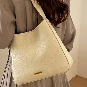 Vintage cream white pleated faux leather tote bag with elegant golden brand plaque