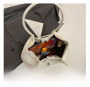 Interior view of white woven tote bag showing large capacity for tablet and daily items