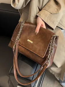 Brown vintage PU leather tote bag with gold chain strap and magnetic flap closure