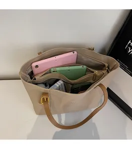 Internal view of beige tote bag with large capacity and multiple storage compartments