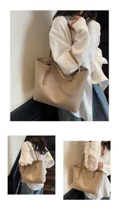 Detail of a large beige PU leather tote bag with brown straps and Fashion Trend COCO text