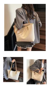 Detailed views of high-quality minimalist tote bag with ivory body and brown handles