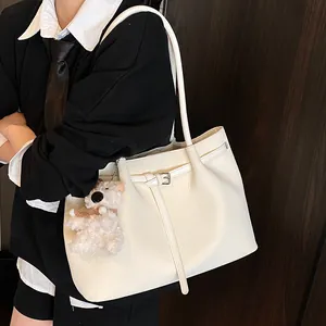 Elegant white woven tote bag with silver buckle strap and cute puppy pendant accessory