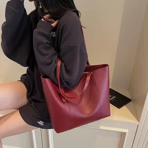 Classic dark red large tote bag in matte synthetic leather with slim shoulder straps