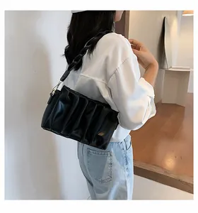 Fashionable black pleated shoulder bag with chain strap and gold hardware for women