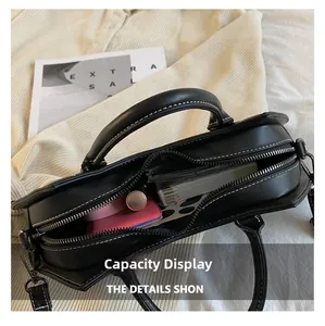 Internal view of bat-shaped PU leather handbag showing storage capacity for daily items