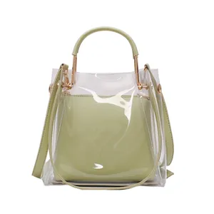 Summer transparent jelly tote bag with green leather handles and inner pouch