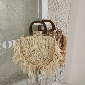 Bohemian woven straw handbags with wooden handles and fringe tassels in beige and brown